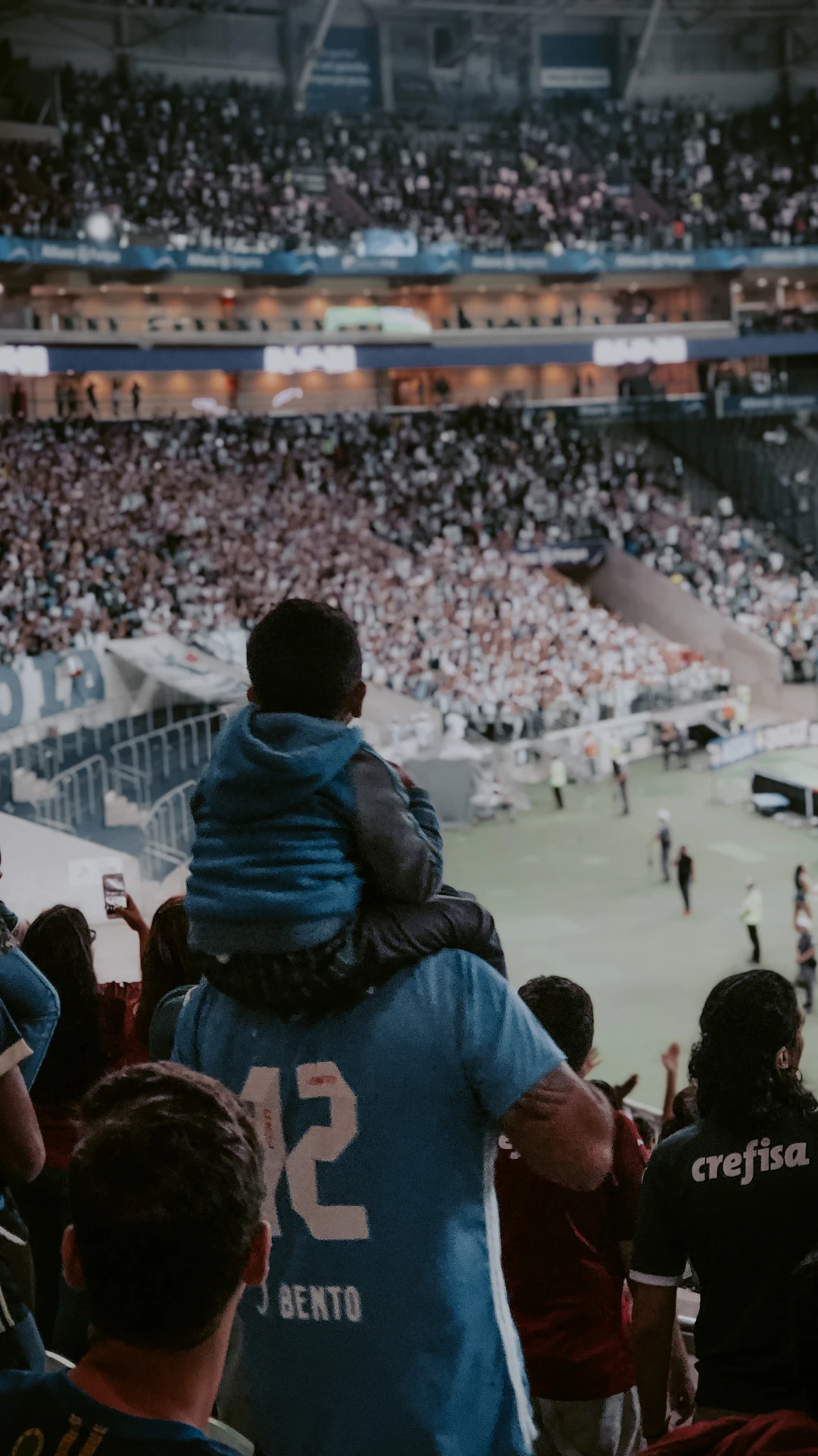 crowd of people watching sports inside arena
