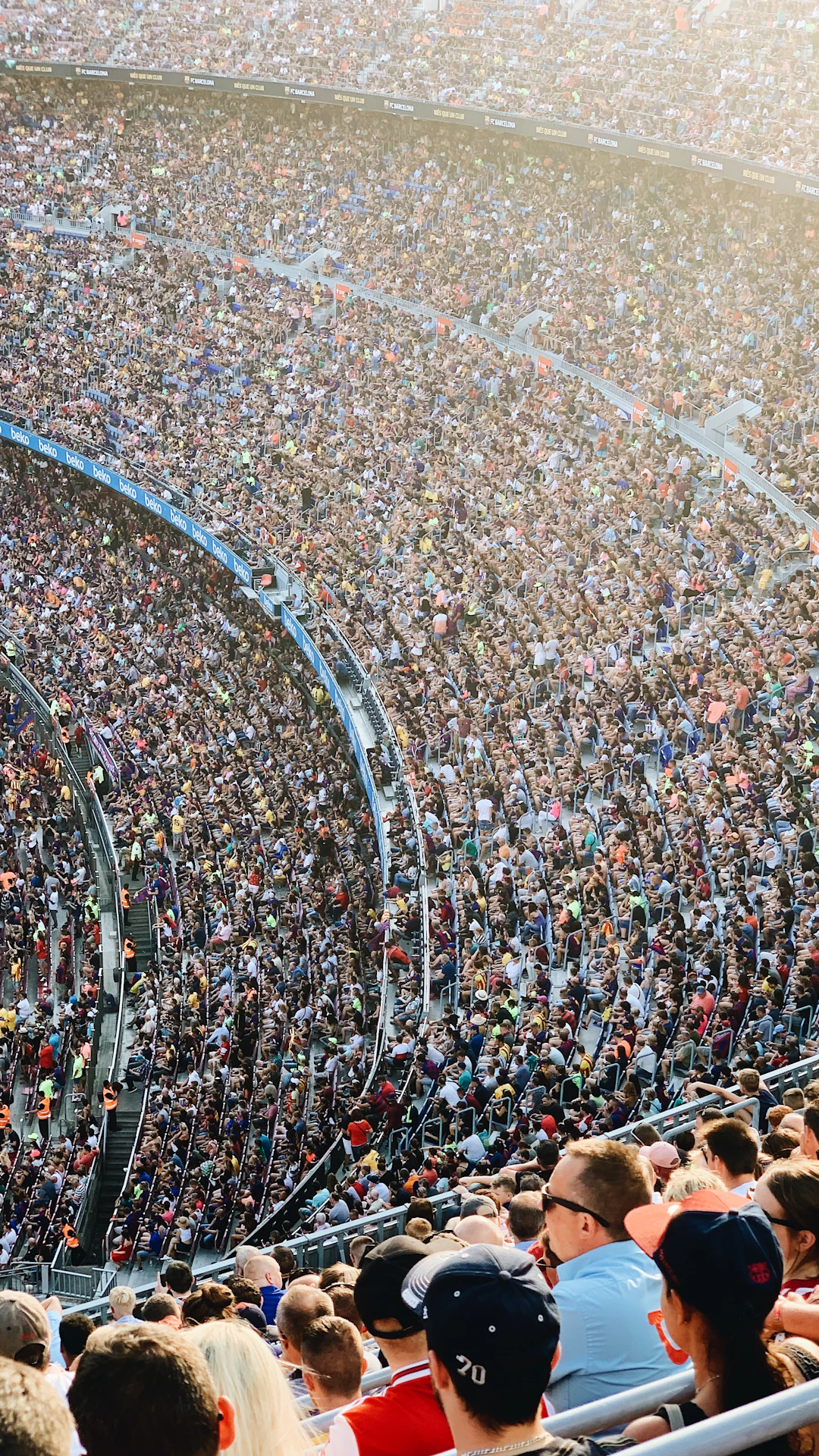 people sitting inside stadium seats