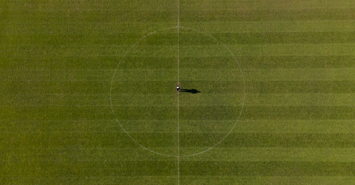 an aerial view of a baseball field with a ball in the middle of the field